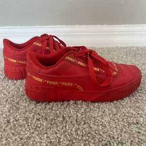 Boys red Puma sneakers
